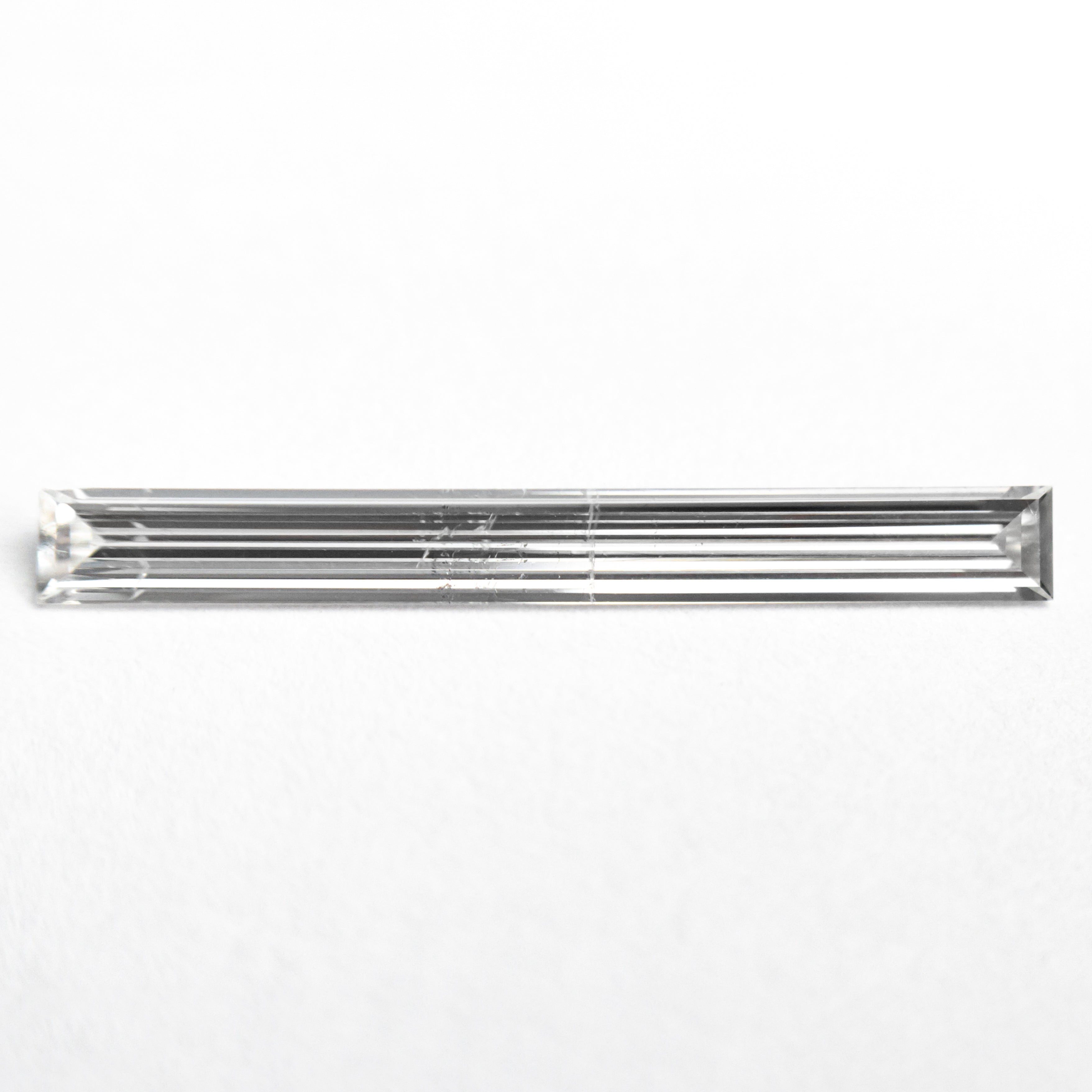 0.52ct 19.44x2.17x1.09mm SI2 E Baguette Step Cut 26545-01