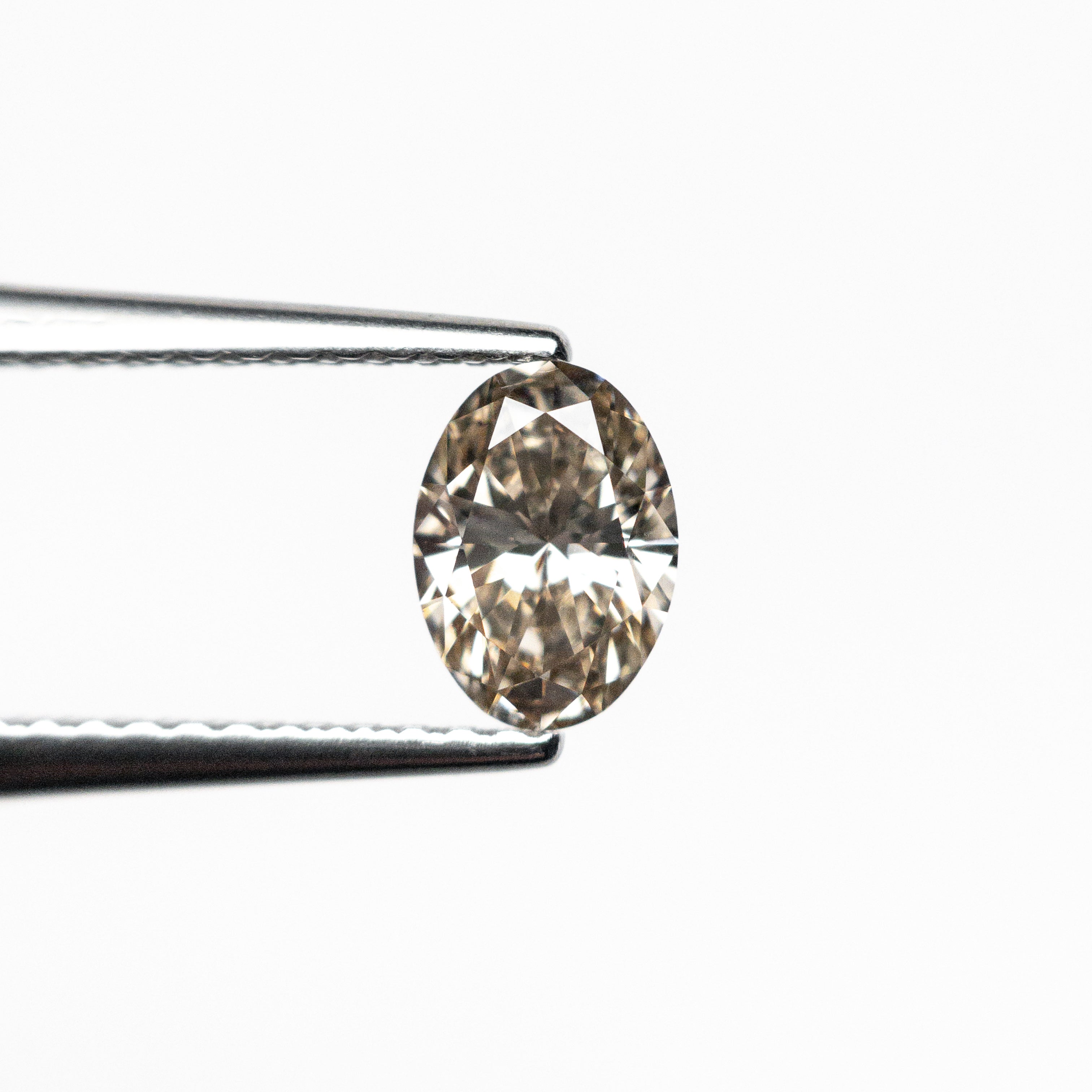 0.53ct 6.41x4.60x2.78mm VS1 C3 Oval Brilliant 26605-02